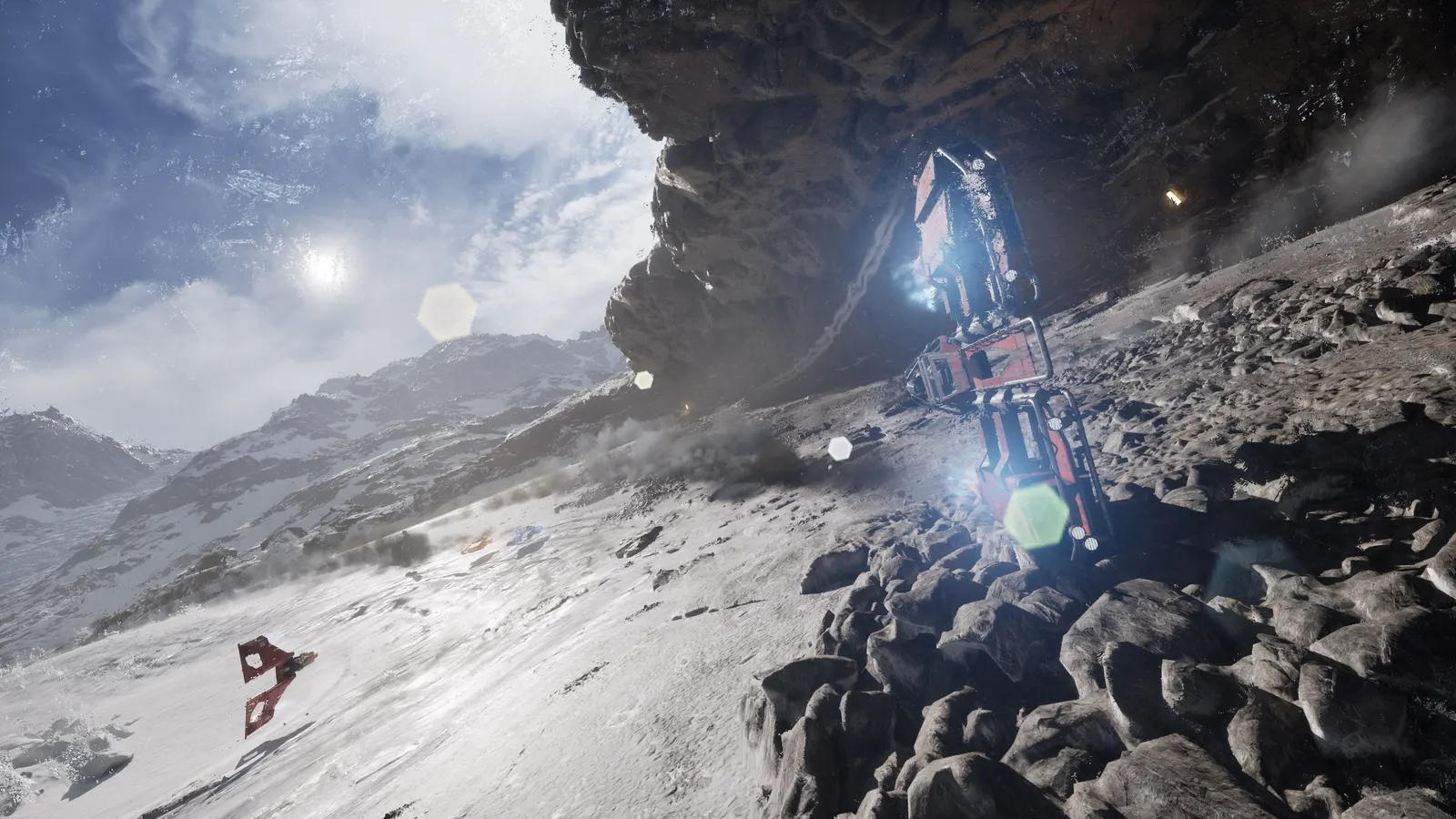 A racing craft emerges from beneath a dark rocky overhang on a snowy slope, with a blue lens flare and a distant red craft in the air